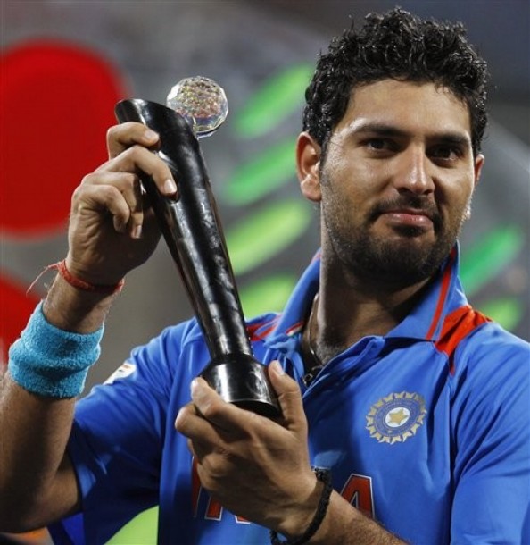 Yuvraj Singh with ICC World Cup 2011 Player of the Series Trophy